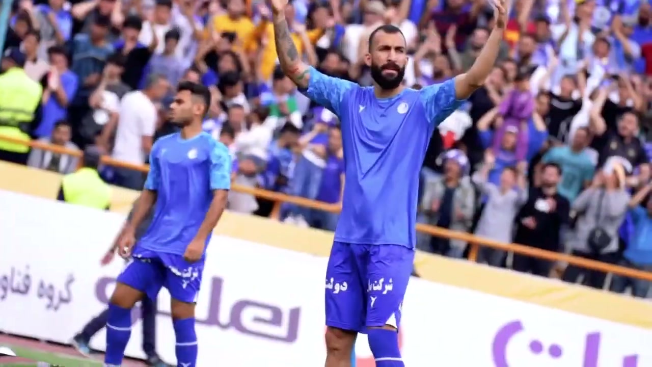 A football player acknowledging supporters in a sports-event frame from Movahed Motlagh's showreel