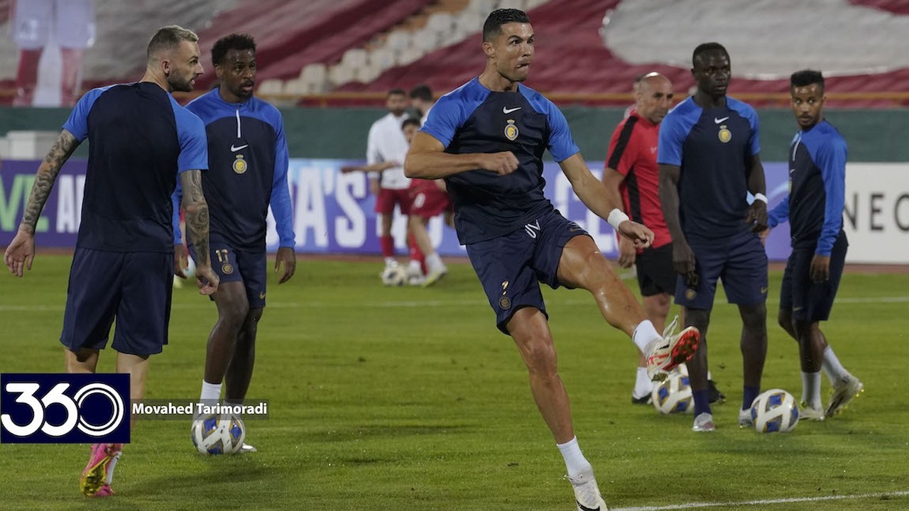 Cristiano Ronaldo striking a ball during Al Nassr training at Azadi Stadium; Football360 logo and photographer credit are visible at lower left