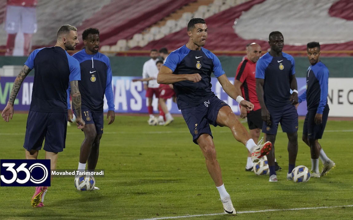 Cristiano Ronaldo striking a ball during Al Nassr training at Azadi Stadium; Football360 logo and Movahed Tarimoradi credit are visible at lower left